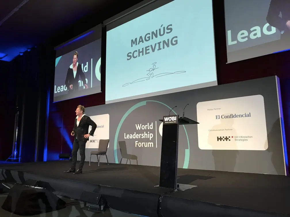 Magnús Scheving speaking on stage at the World Business Forum about leadership and performance