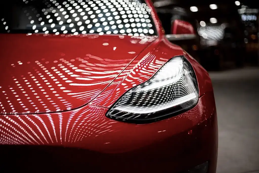 Close up of Tesla electric car headlight and front design highlighting modern automotive innovation