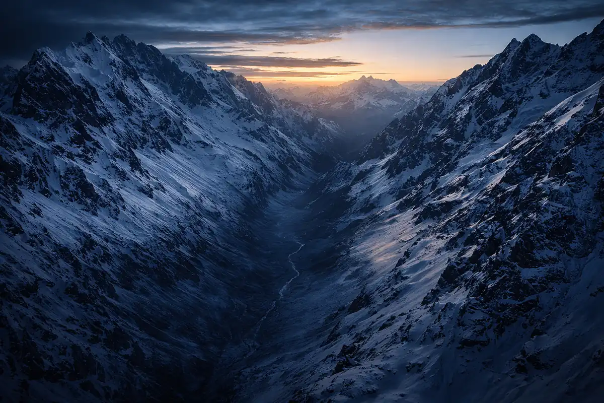 Snow-covered Andes mountains at dusk representing Nando Parrado survival story - motivational speaker resilience leadership | Aurum Speakers Bureau