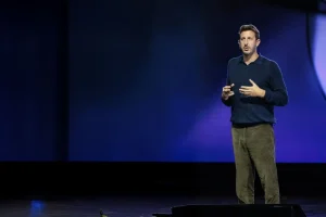 Zack Kass speaking about AI strategy and business transformation at a conference