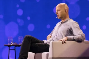Sebastian Thrun speaking onstage about artificial intelligence, online learning, and workforce innovation