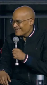 Leo Olebe holding a microphone and speaking at an event - leo olebe scaling leadership | Aurum Speakers Bureau