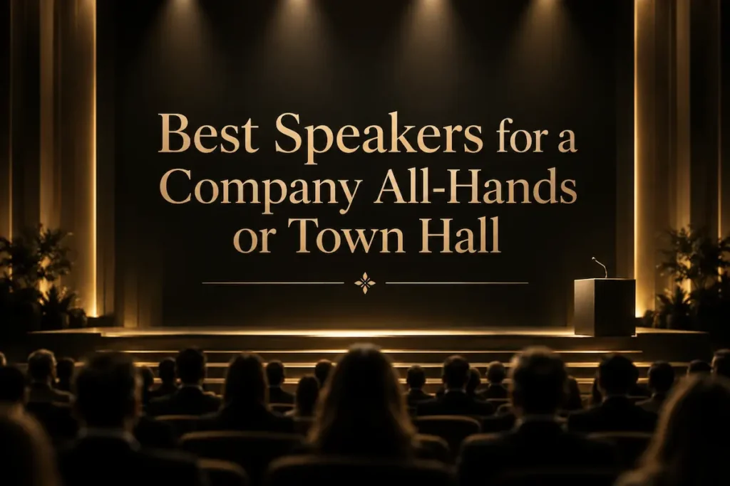 An abstract gold-lit auditorium representing a company all-hands, beside the title on the best all-hands speakers - speakers for a company all-hands | Aurum Speakers Bureau