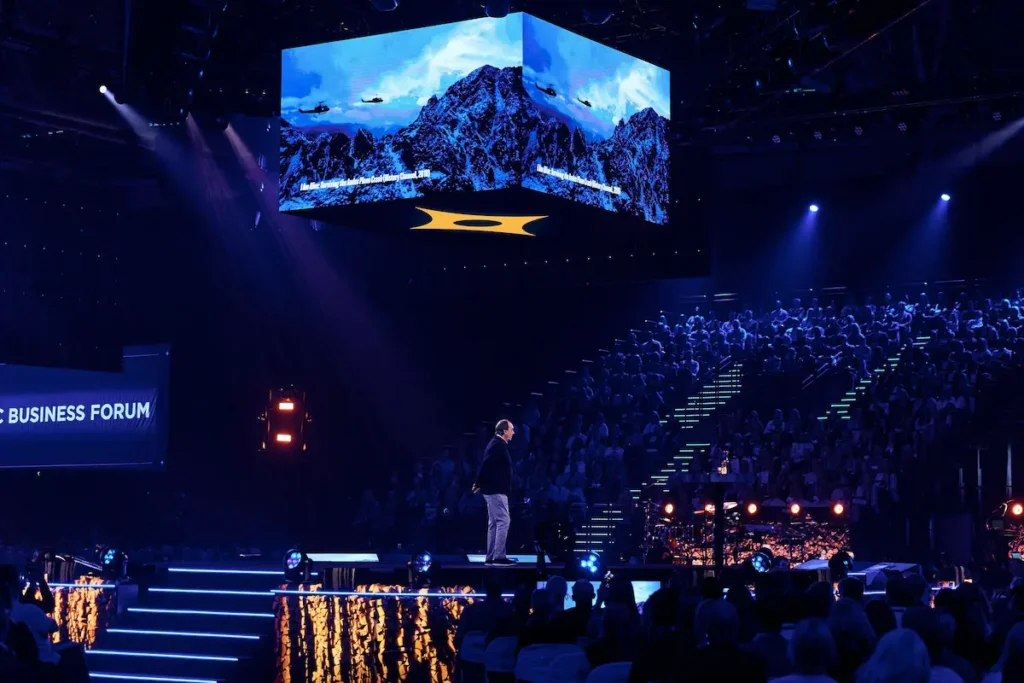 Nando Parrado on the main stage at Nordic Business Forum 2026, surrounded by an audience of thousands - nando parrado nordic business forum | Aurum Speakers Bureau