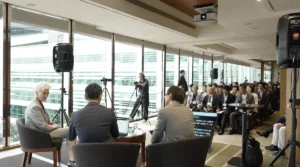 Attendees watching Maye Musk speak at an intimate business gathering in Hong Kong - maye musk ageless success | Aurum Speakers Bureau