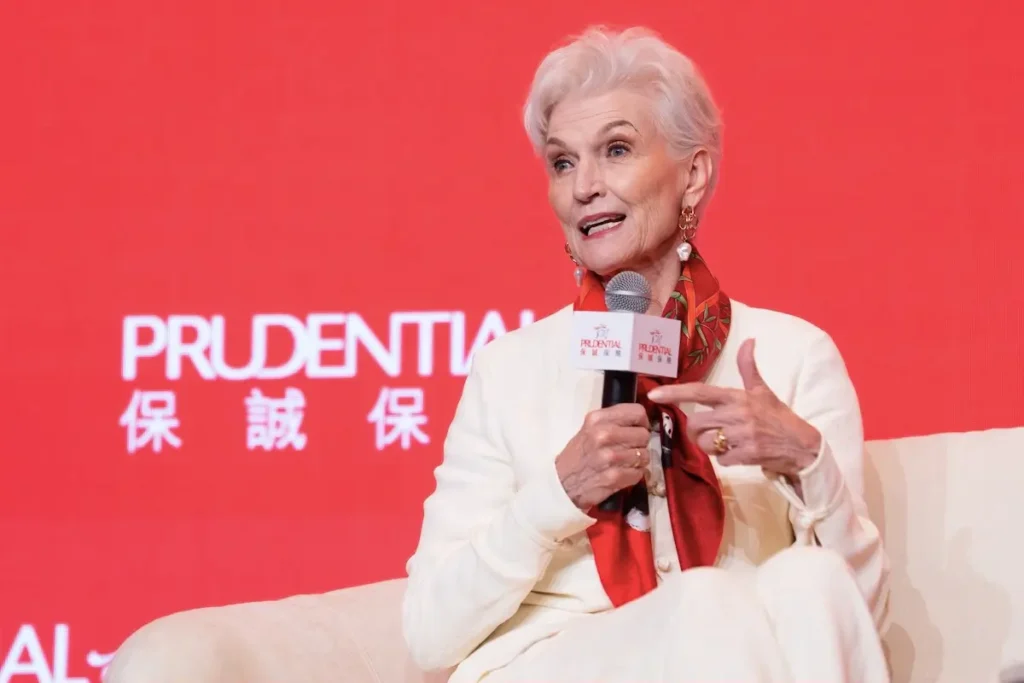 Maye Musk delivering a keynote on stage in Hong Kong - maye musk ageless success | Aurum Speakers Bureau