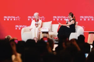 Maye Musk in a fireside chat with a moderator at the Prudential event in Hong Kong - maye musk ageless success | Aurum Speakers Bureau